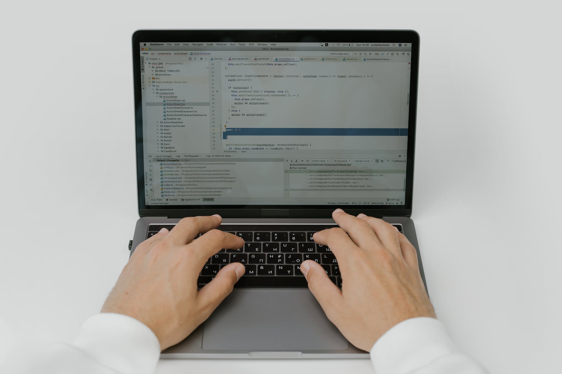 hands on a laptop keyboard